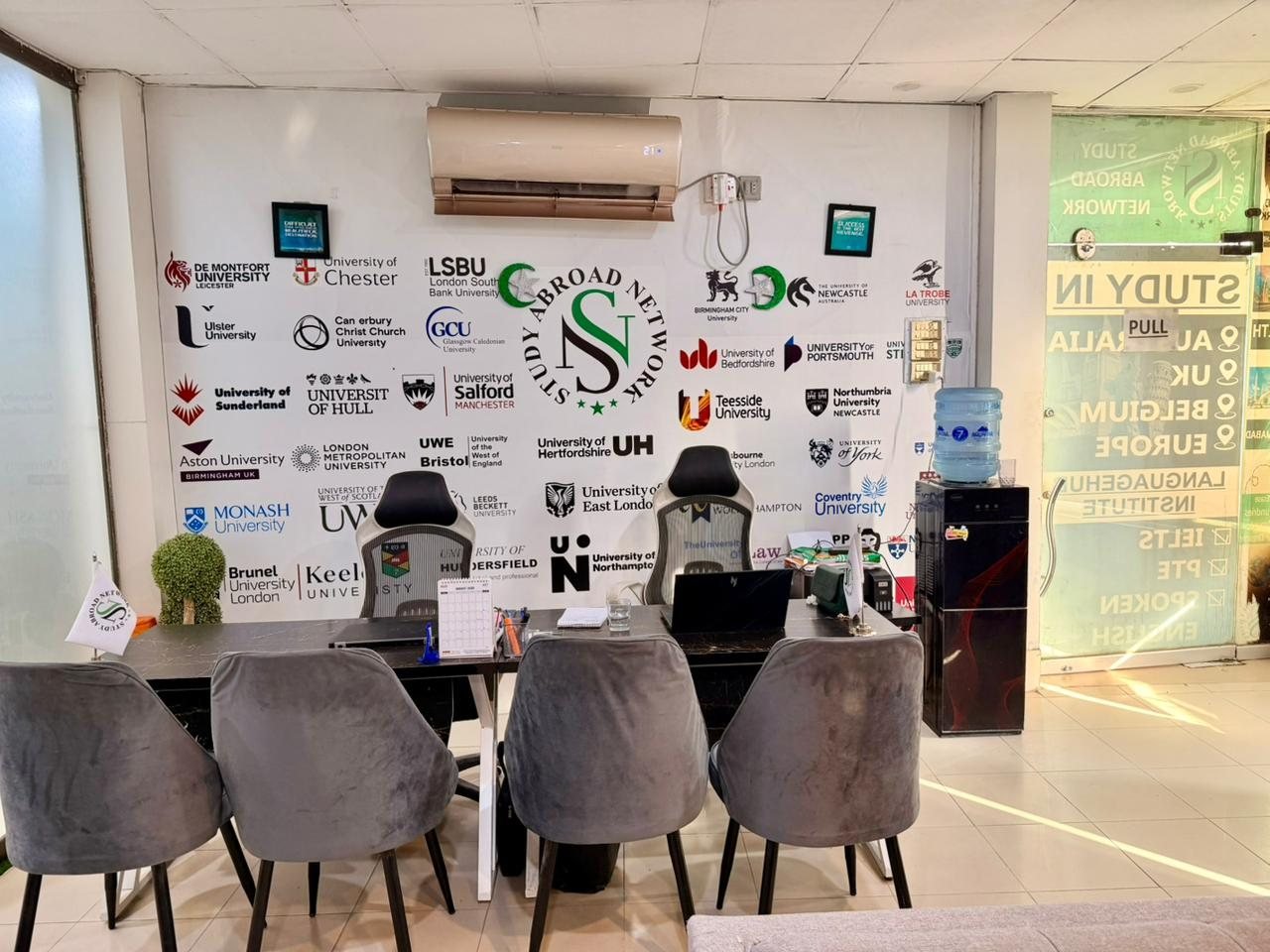 Reception with partner university logos